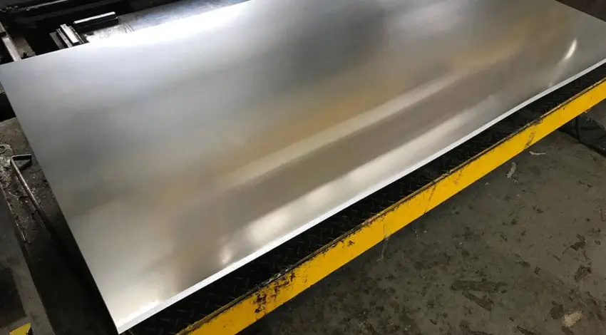 Stamped 6061 aluminum car body panel with smooth finish on industrial manufacturing equipment