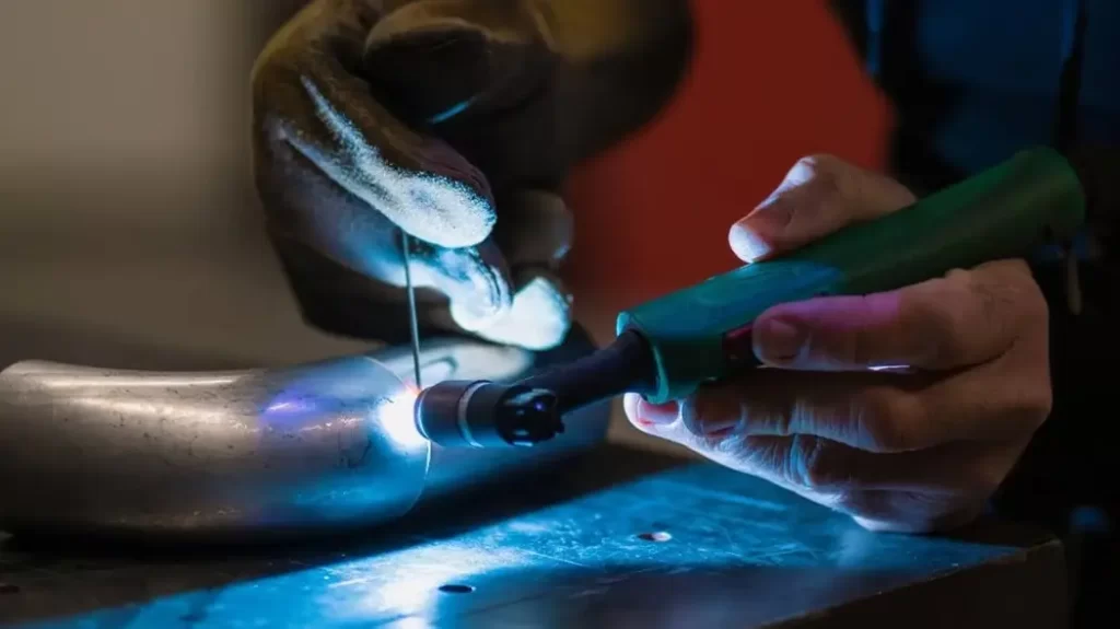 An image of a welder joining aluminum part by using TIG welding approach.