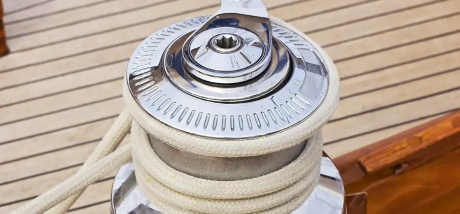 Chrome plated wench with a wooden boat and rope