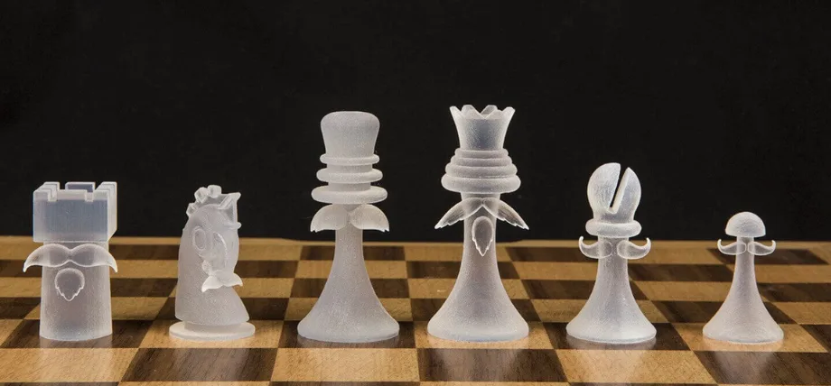 walnut color chess board with 6 chess pieces in white