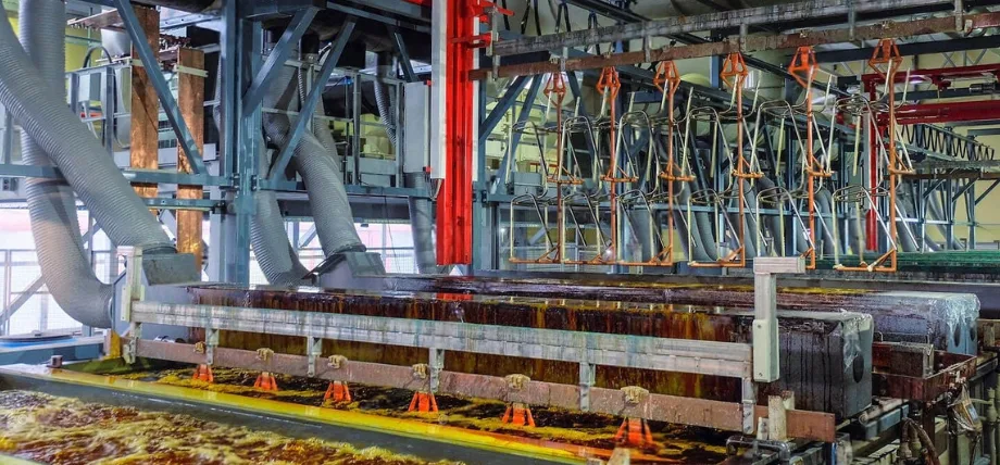 Galvanic copper, chrome, nickel electroplating industrial line with containers and cranes.