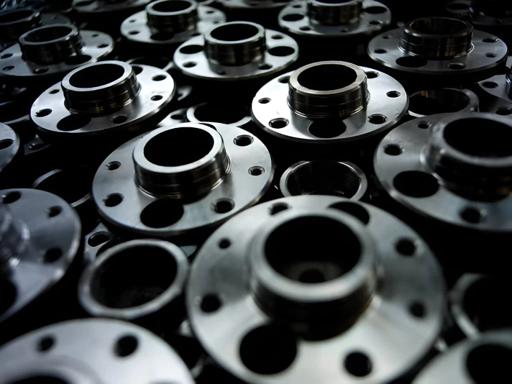 CNC machined automotive parts are displayed in an organized layout.