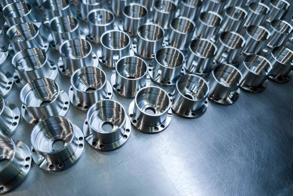 CNC machined aerospace parts in bulk are placed on the floor.