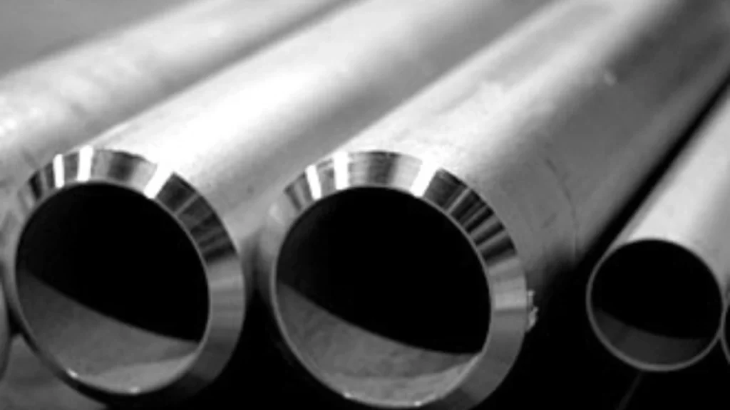 A close-up view of duplex stainless steel pipes arranged closely in a neat, parallel layout.