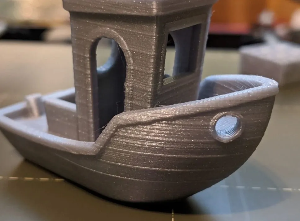 A small FDM printed part with visible lines