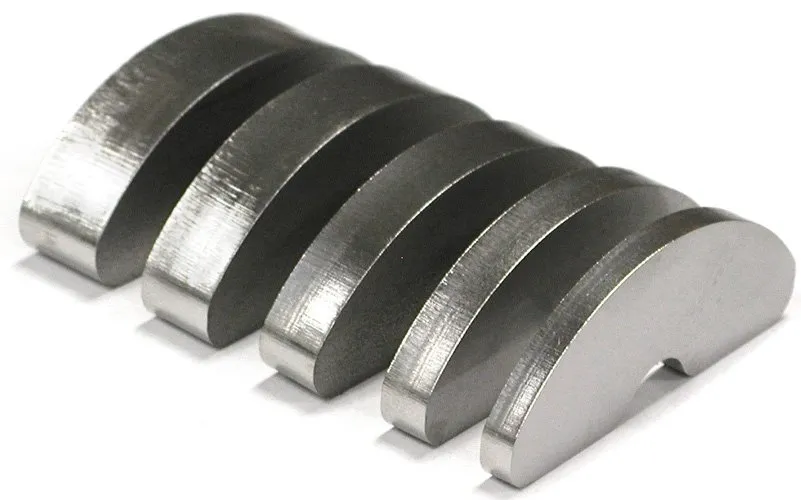 Five arc-shaped stainless steel metal pieces cut by a Fiber laser