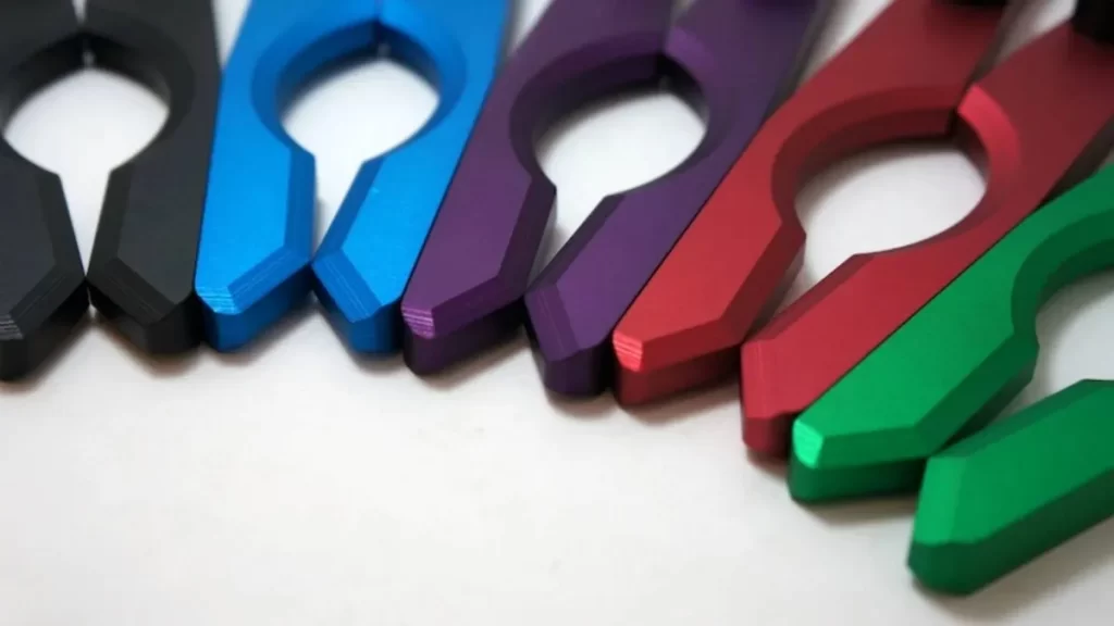 An image displaying anodized parts in a vibrant colors, neatly arranged.