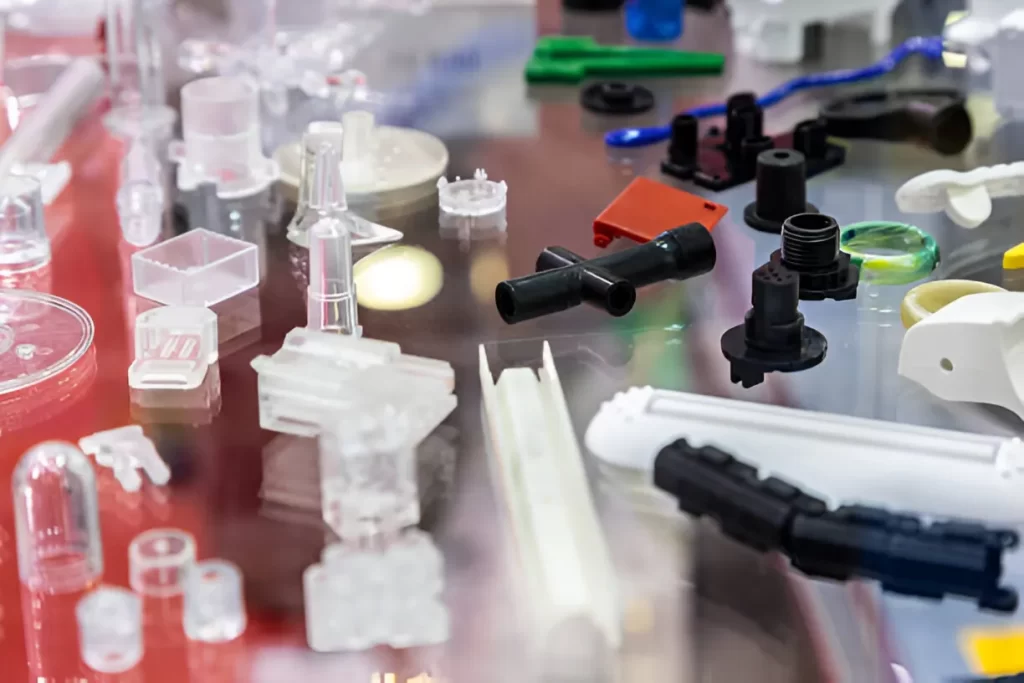 Injection molded goods and prototypes on a display table.