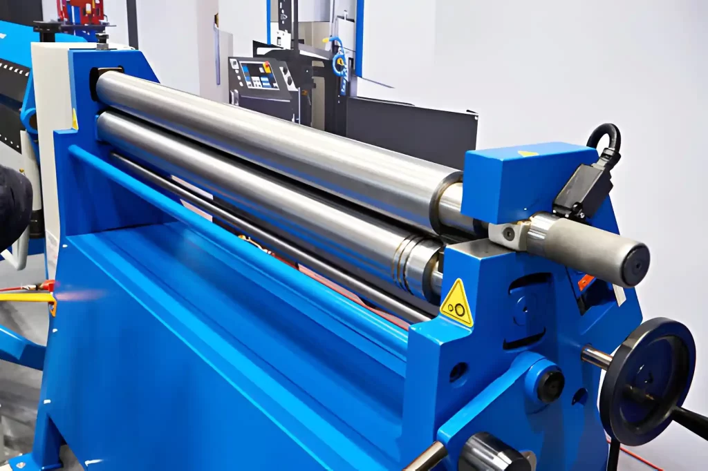 A hydraulic sheet metal rolling machine displayed in a workshop setting.