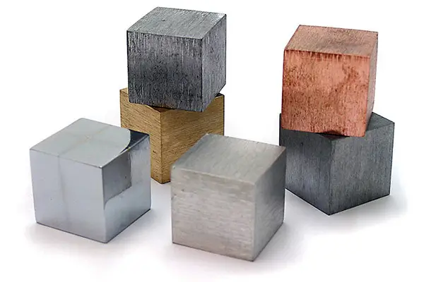 Assorted metal cubes in different finishes and colors.
