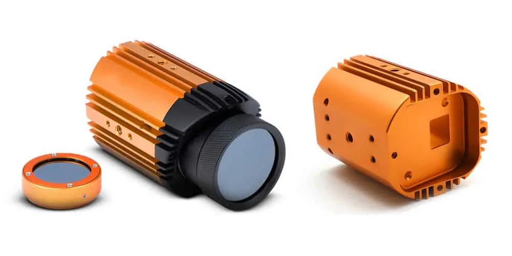 Orange anodized CNC-machined aluminum components with precision detailing and removable parts
