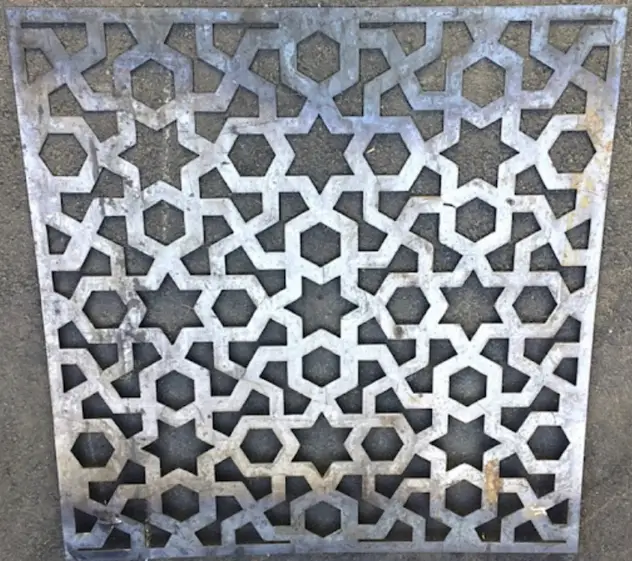 Plasma-cut sheet metal panel with geometric star pattern 