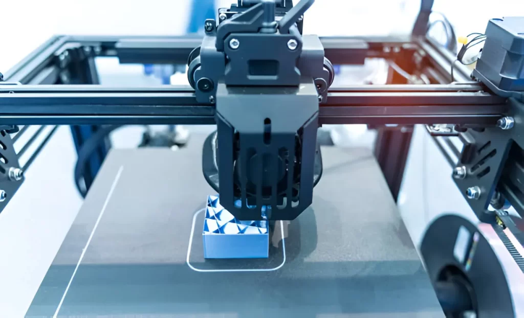 A 3D printing machine makes a prototype design using successive layers of plastic filament.