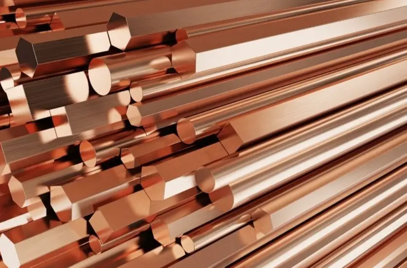 Hexagonal red brass bars with smooth surfaces and sharp, well-defined edges 