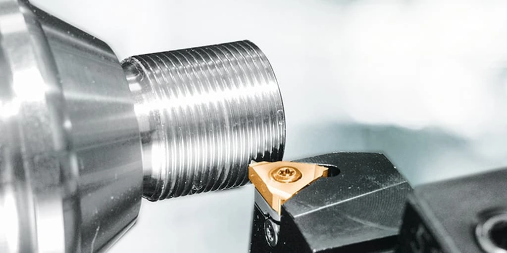 A close-up view of the tool refining the threads 