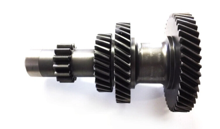 Precision-machined aluminum transmission gear assembly with helical teeth on a white background