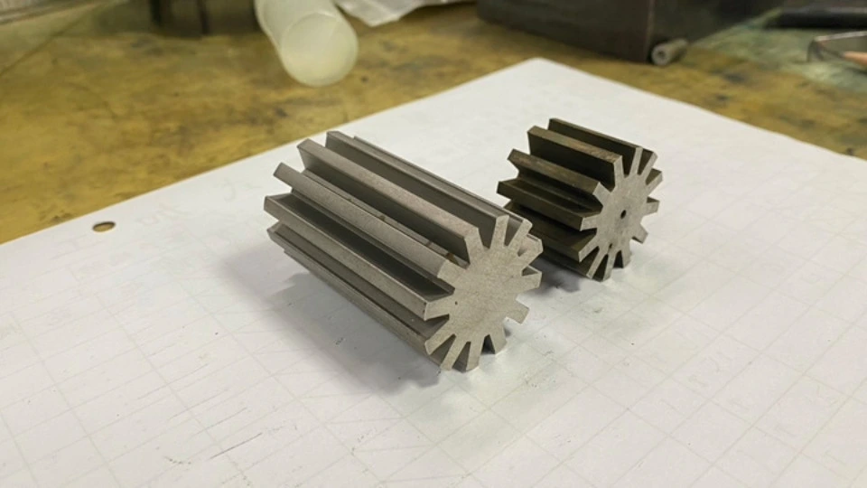 A pair of parts cut using a waterjet cutter.